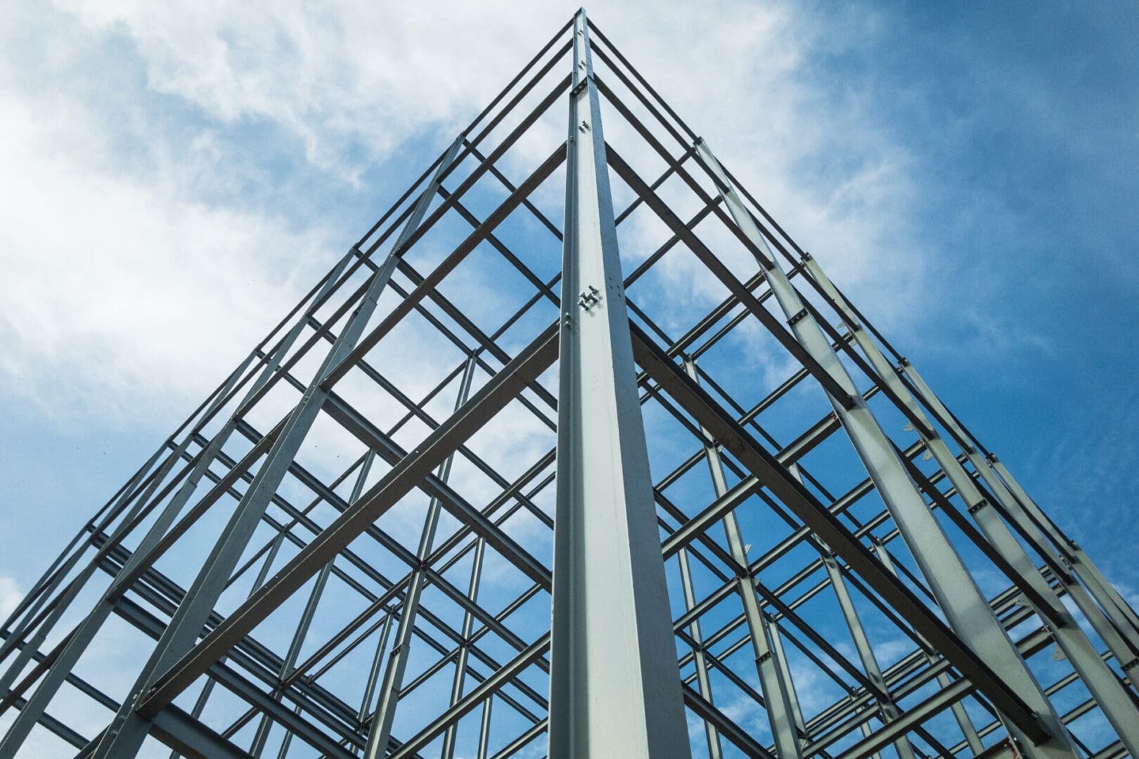 A building structure with metal frame against the sky.