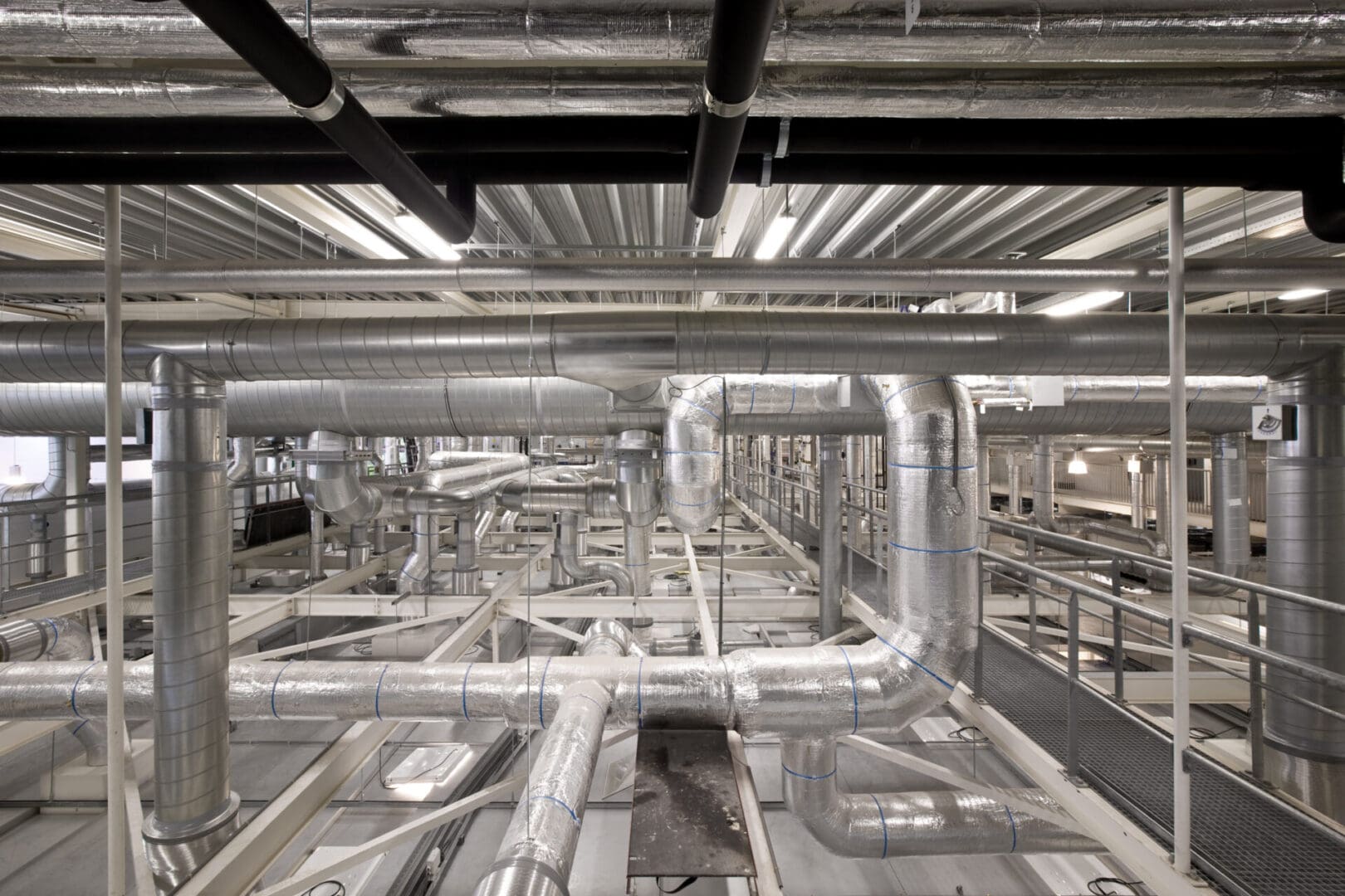 A large metal pipe system in an industrial setting.